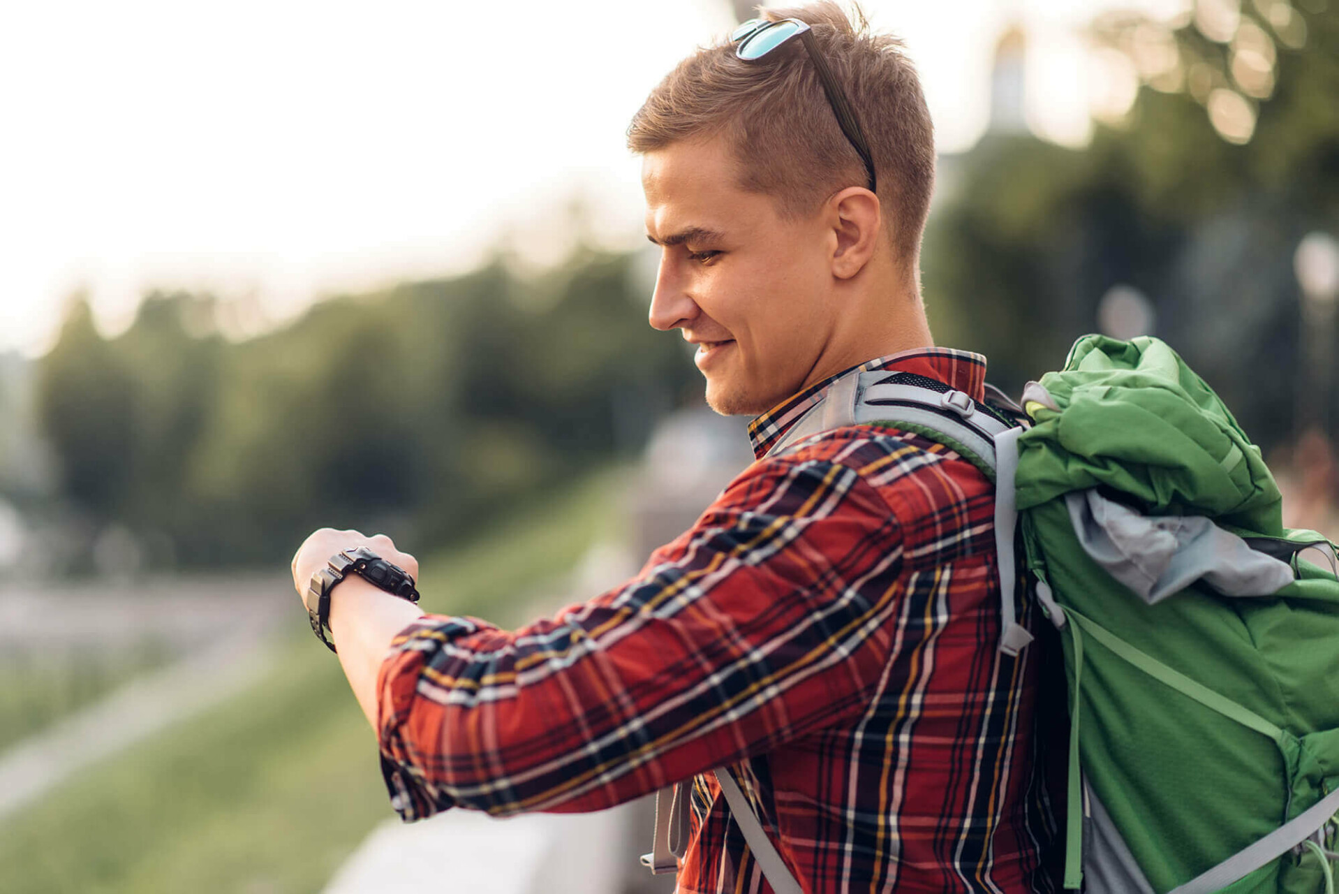 male-tourist-with-backpack-looking-at-the-clock-WF9TY3G-1.jpg